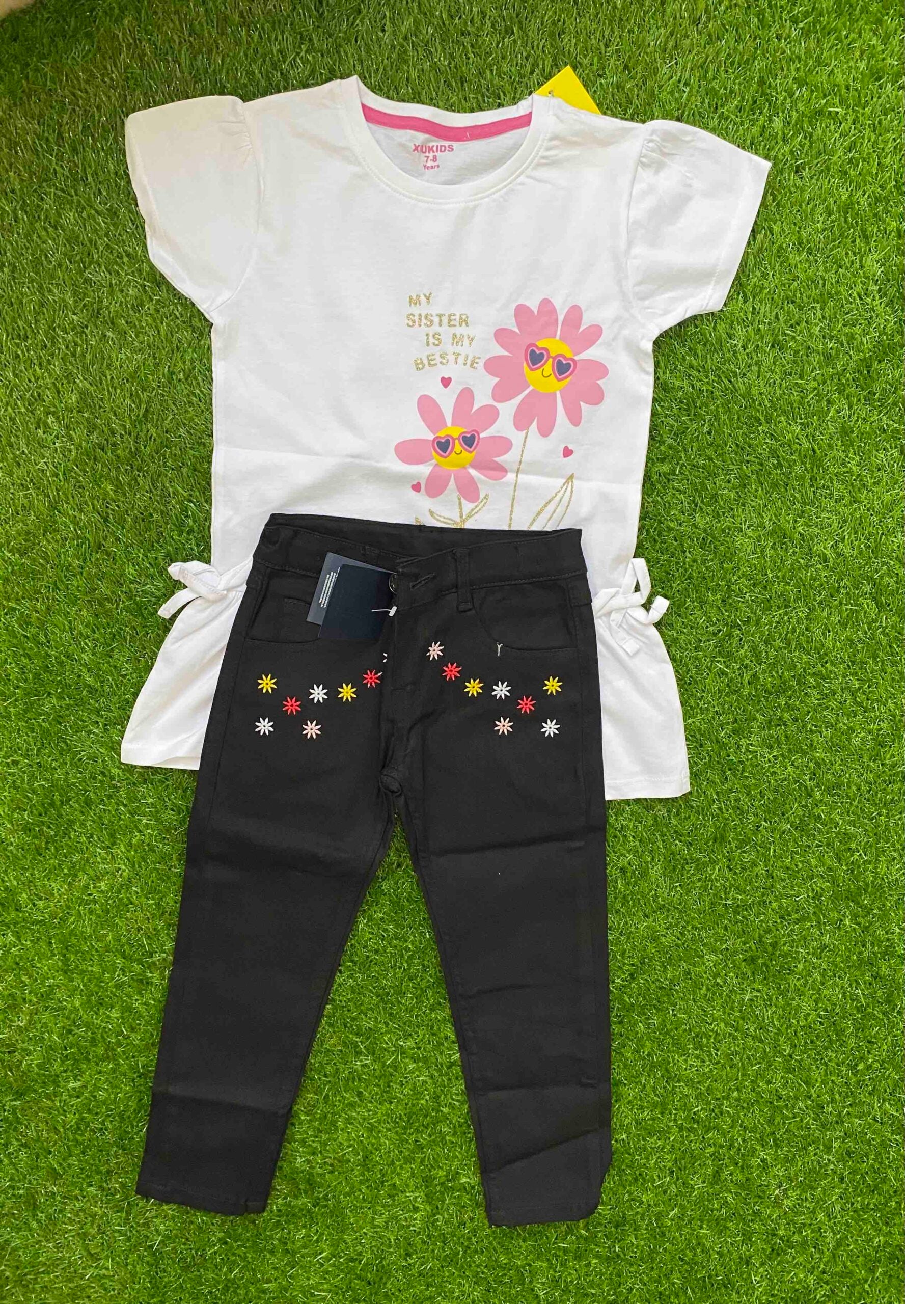 Daisy Delight - White Shirt paired with Black Jeans