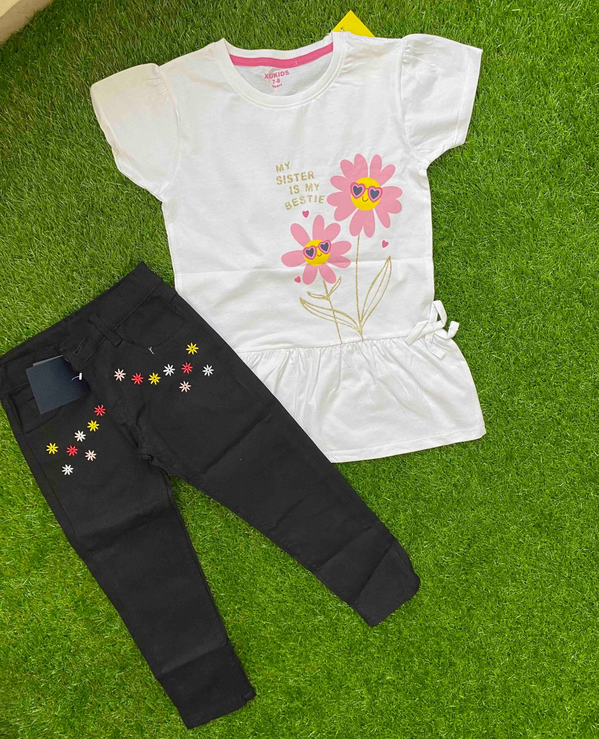 Daisy Delight - White Shirt paired with Black Jeans
